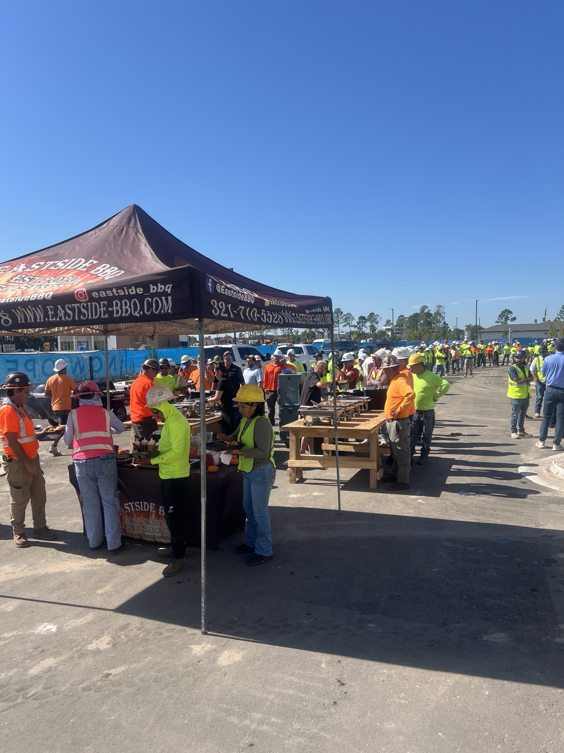 Outdoor catering with the Eastside BBQ tent and serving stations