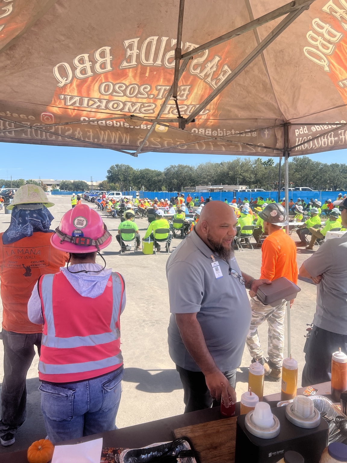 Guests collecting meals at the Eastside BBQ serving station
